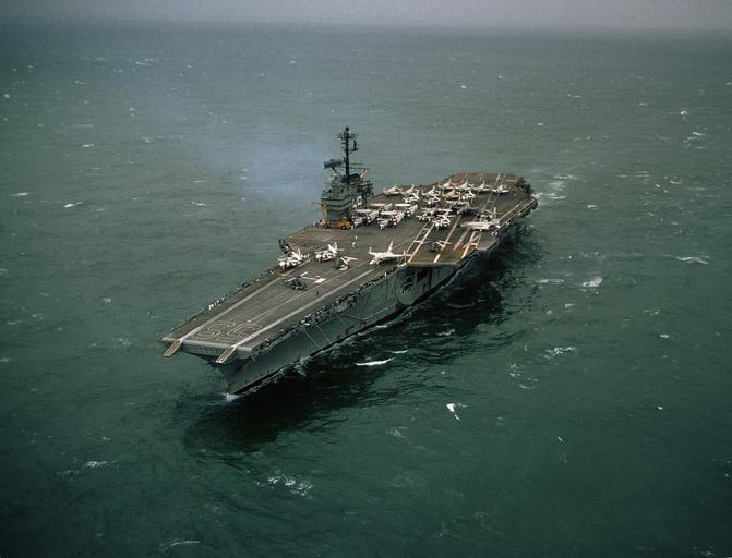 Forrestal about one month after 1967 fire.jpg en An aerial port bow view of the Forrestal Class Aircraft Carrier USS FORRESTAL CVA 59 underway approximately one month after fires and explosions damaged the ship leaving 134 crewmen dead 161 ...