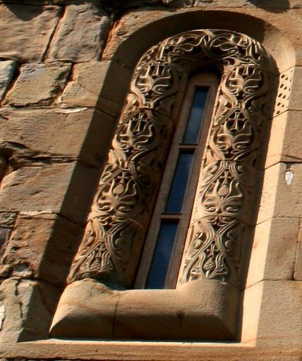 Ananuri facade window left.jpg en Ananuri facade with an ornate cross Image Ananuri facade jpg Kober 2008 Ananuri Reliefs of Ananuri Church windows in Georgia