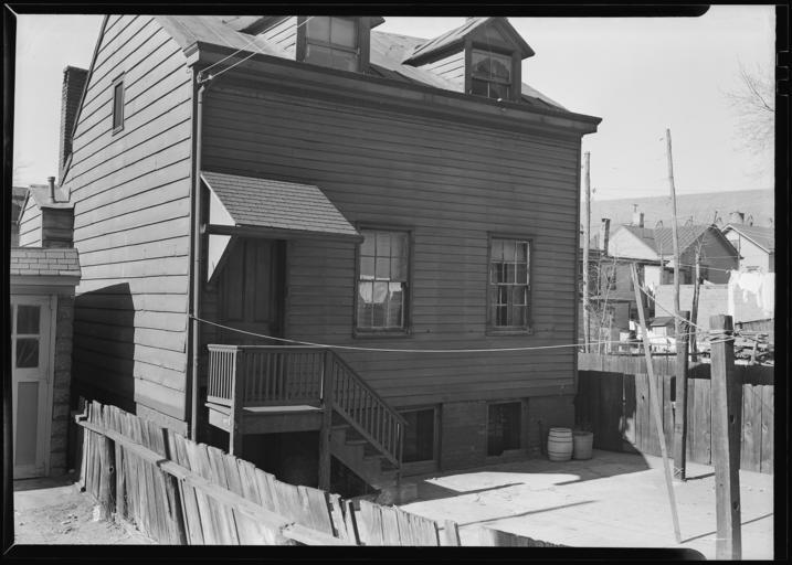 Original Caption: Paterson, New Jersey - Textiles. Home of silk workers in rear (inner) court off Sealey St. (very poor interior), March 1937 U.S. National Archives’ Local Identifier: 69-RP-366 Photographer: Hine, Lewis Subjects: The New ...